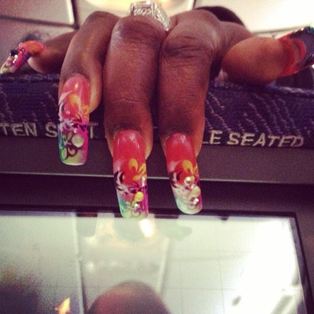 "Maybe she thought, grabbing the back of the seat is okay because she got colorful nails to display!"
